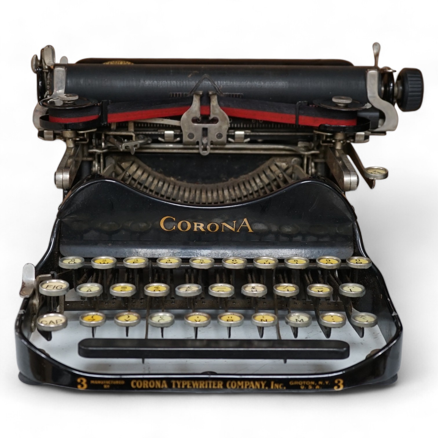 A cased Corona travelling typewriter. Condition - fair